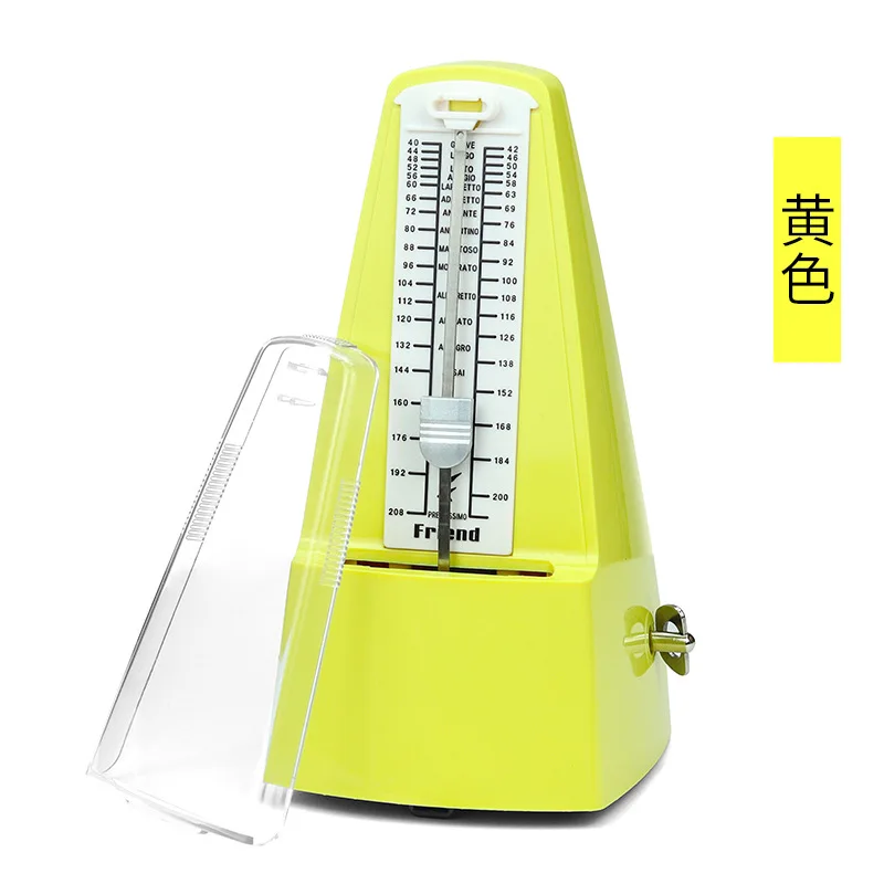 métronome jaune et blanc avec couvercle transparent